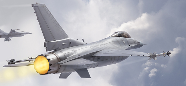 An Military F-15 plane flying under clear conditions.