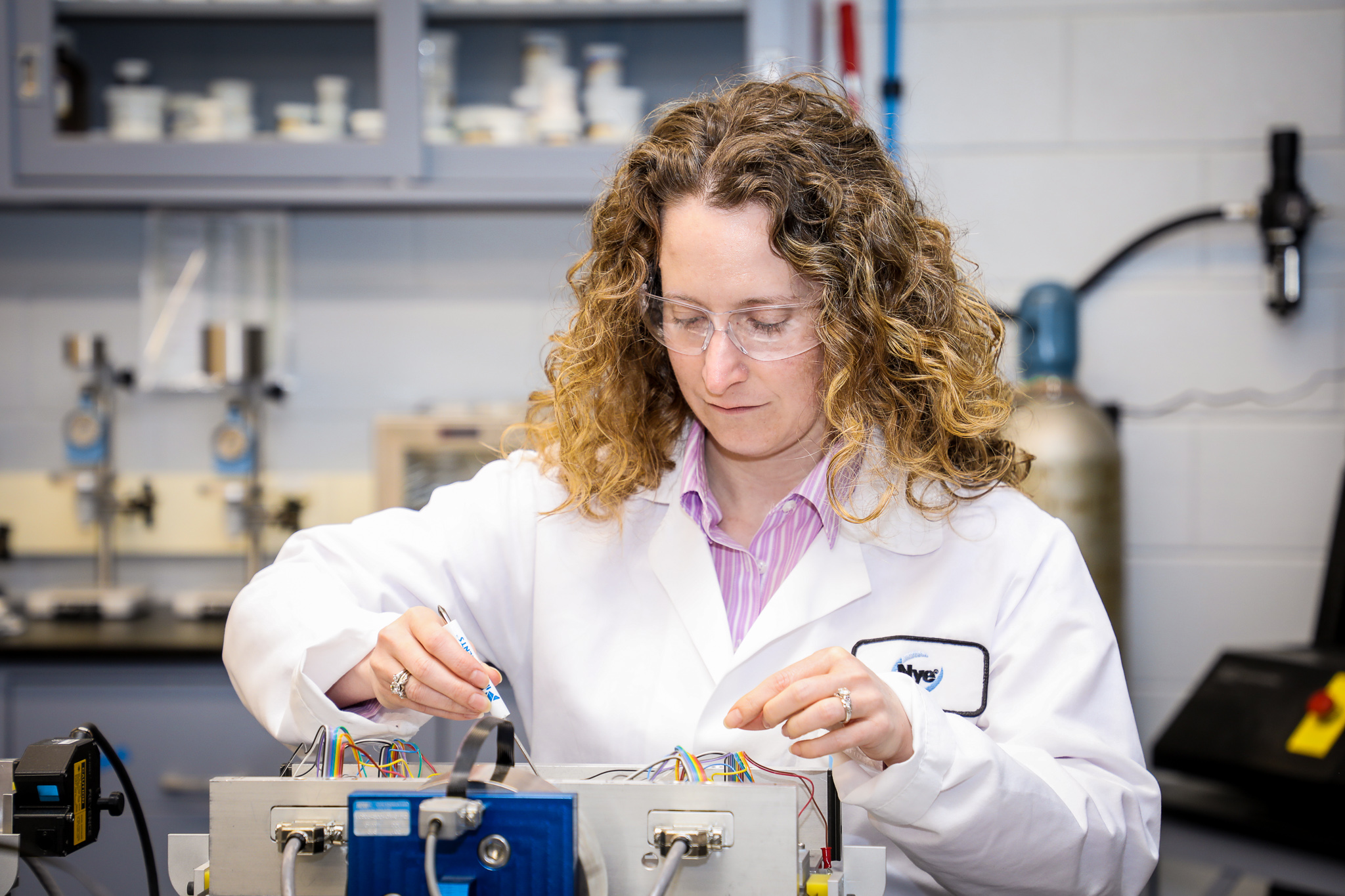 Nicole St.Pierre tests lubricants in one of Nye Lubricant's research and development laboratories. 